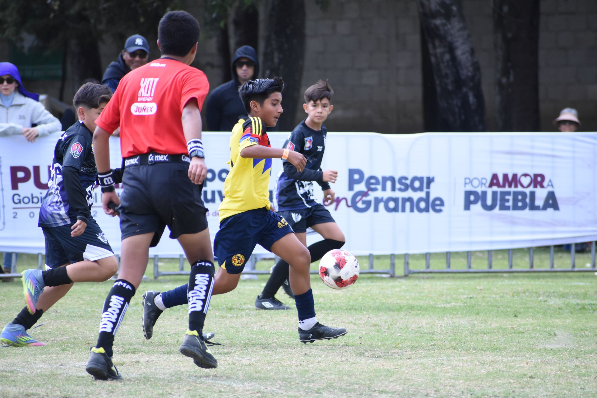 Two players competing for the ball in a match