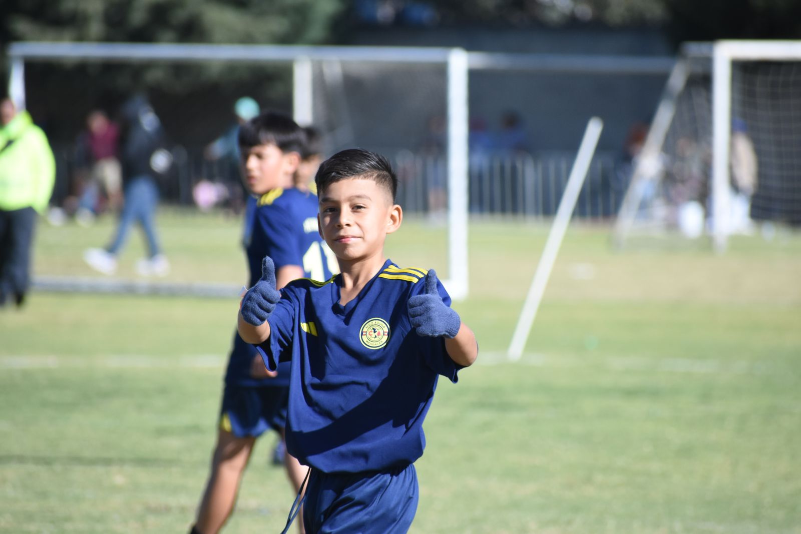 A young player running forward with joy