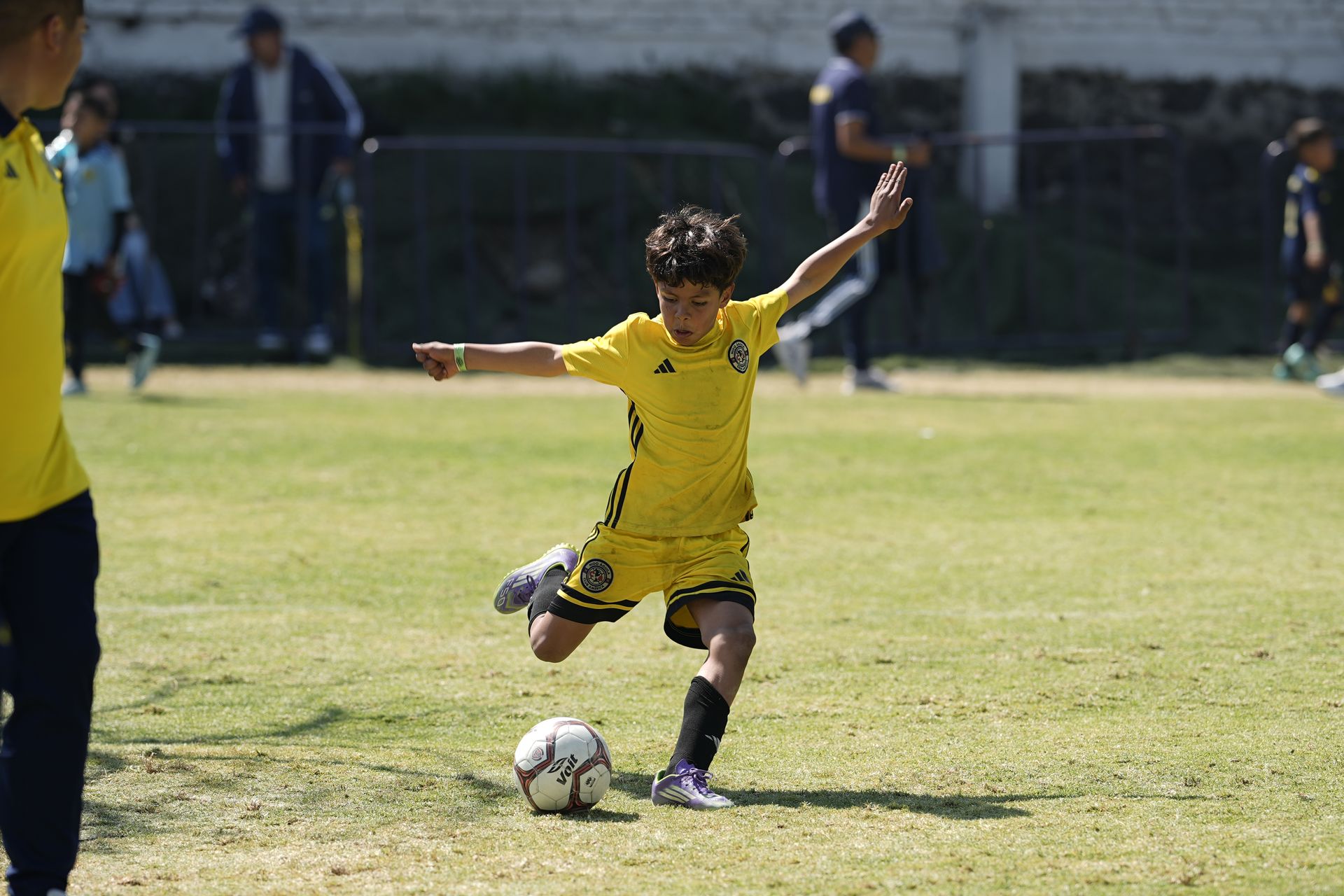 A young player celebrating with arms wide open